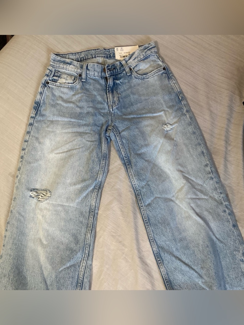Woman’s Light Blue Distressed Jeans
